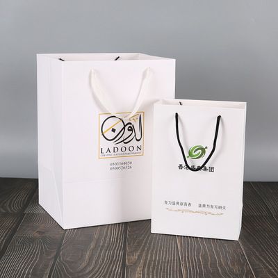 廠家直銷購物手提白卡紙禮品袋創意牛皮服裝紙袋定制logo